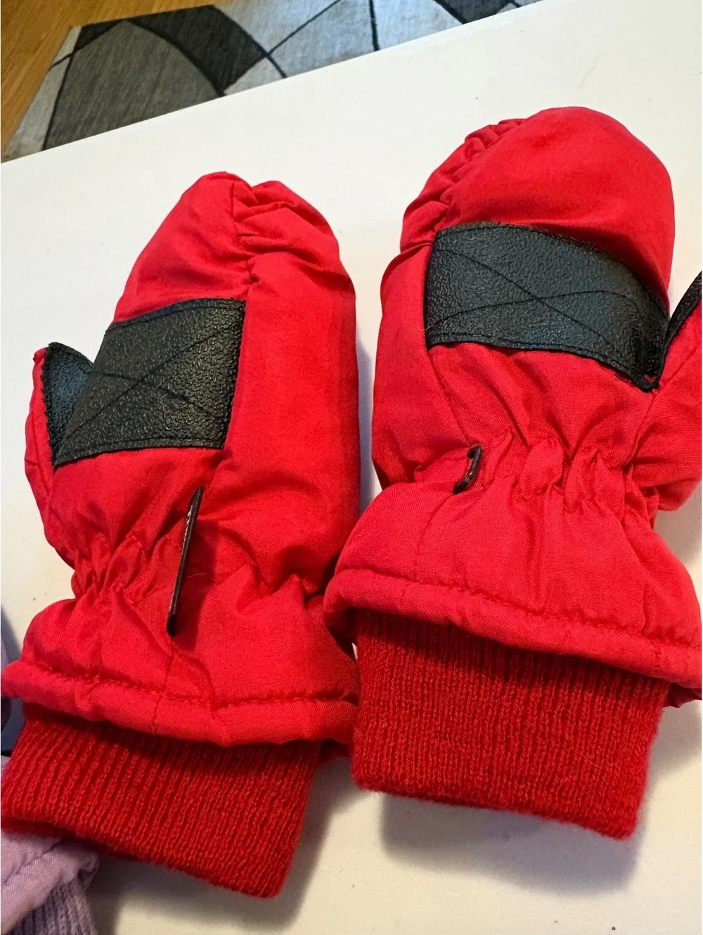 Three pairs of kids mittens